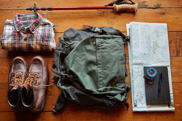 Geared for adventure. Shot of hiking gear arranged on a table.