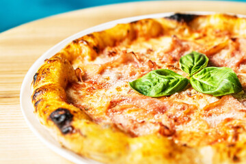 Hot tasty traditional italian pizza with ham.
