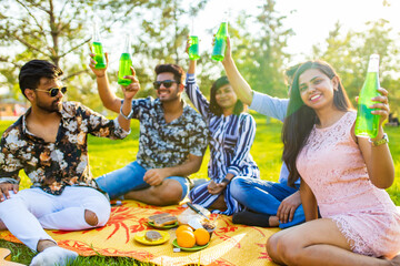 multiethnic people spending time together playing guitar