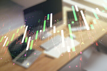 Abstract creative financial graph and modern desktop with computer on background, forex and investment concept. Multiexposure