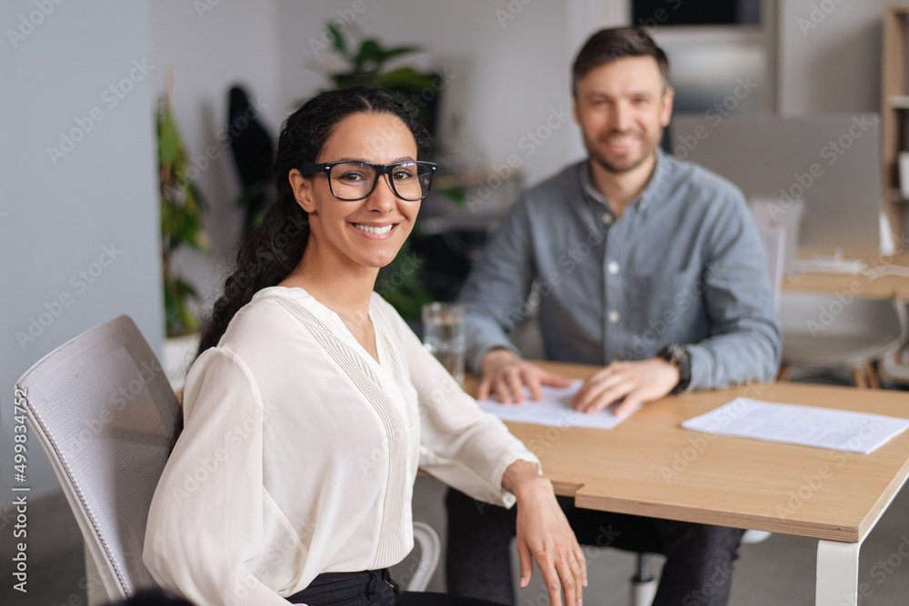Poster Happy HR manager and successful vacancy applicant posing and smiling at camera during job interview at office
