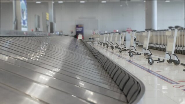View of airport luggage conveyor belt area. empty baggage claim belt.