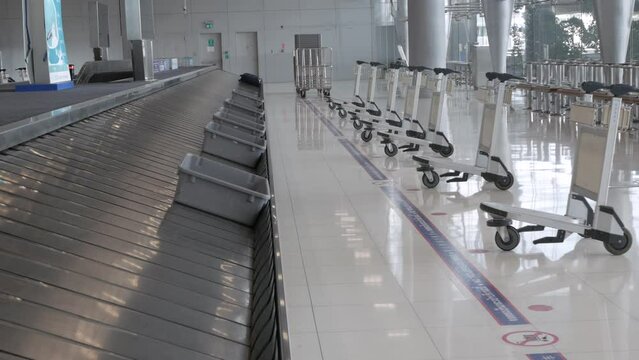 View of airport luggage conveyor belt area. empty baggage claim belt.