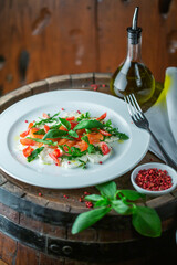Mozzarella Salmon Salad on wooden Table