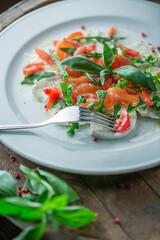 Mozzarella Salmon Salad on wooden Table