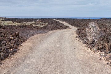 Landscape of a coastal path in the natural park of Timanfaya, Lanzarote