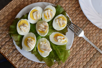 Eggs with mayonnaise on a plate