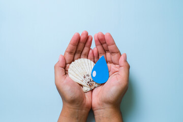 Hands holding earth globe, world environment day, world earth day, world ocean day.