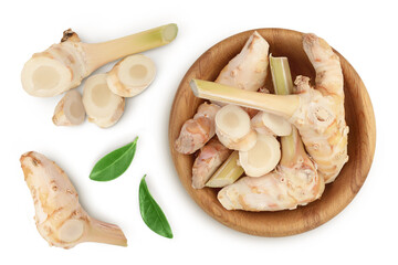 Fresh galangal root in wooden bowl isolated on white background with clipping path and full depth of field. Top view. Flat lay