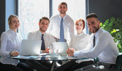 Portrait of a positive business employees at an office business meeting.