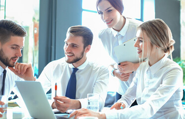 Obraz premium Group of business partners discussing ideas and planning work in office.