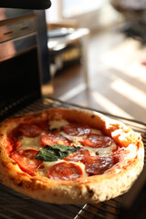 Neapolitan pepperoni pizza in the oven