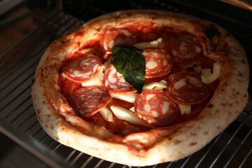 Neapolitan pepperoni pizza in the oven