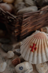 Shell with a handmade Christian cross of the Spanish 
