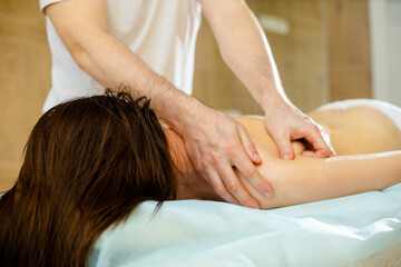 Fototapeta na wymiar Massage in the spa salon