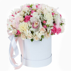 Light flower bouquet in small round paper box on white background