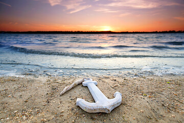 romantic anchor at the sandy beach sunset © Jenny Sturm