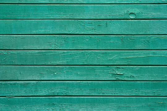 Industrial background - view of the wall of a old wooden railway wagon. Background of wooden boards close up