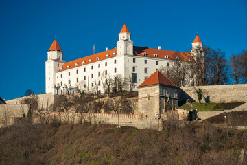 Fototapeta na wymiar Slovakia - Bratislava - Bratislava old town with castle (aka Bratislavsky Grad, Pressburger Schloss or Pozsonyi Var)