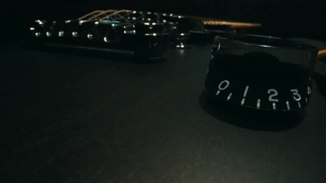 Volume control on six-string electric guitar.