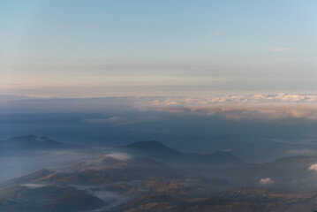 Landscape seen from a plane of mountains between mists in a Colombian mountain range.