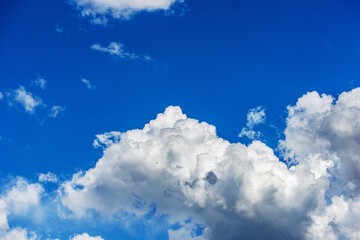 Obraz na płótnie Canvas Beautiful storm clouds, cumulus clouds or cumulonimbus against a clear blue sky. Photography, Full frame.