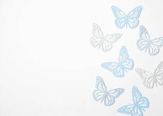 Pastel Blue Butterflies on a White Background. Simple Modern Composition with Paper Cut Butterfies...