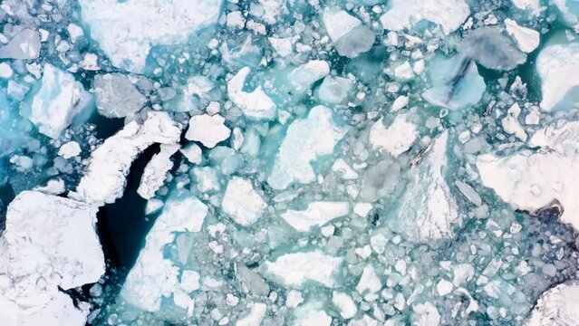 Icebergs from melting glacier in ice lagoon. Majestic Arctic Deep Clear Water. Climate Change Global Warming problem. Iceland.