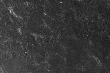 Fototapeta na wymiar Abstract textured dark stone wall surface for background