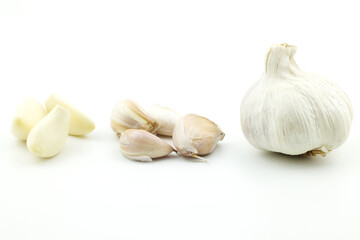 Closeup of a group lobe garlic (Allium sativum), whole of garlics head bulb and garlic with out peels collection vegetable Isolated on white background, spiciness aromatic herb