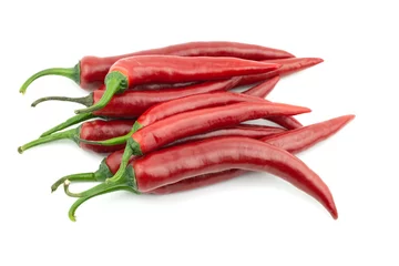 Fotobehang A group of fresh raw ripe hot organic red chili peppers whole isolated on white background clipping path © Ramaimapon