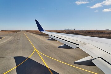 Plane wing from window before takeoff - 499857139