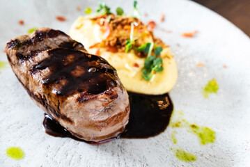 steak with mashed puree and sauce