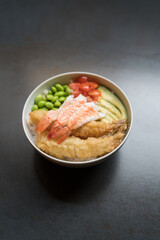 raw shrimp poke, edamame, tomato and rice in bowl, Japanese cuisine