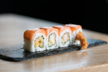 uramaki of rice, salmon and avocado, Japanese cuisine