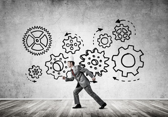King businessman in elegant suit running in empty room with wooden floor