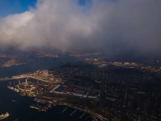 A magical flight in the clouds over the city. The sun's rays are beautifully reflected from the clouds. Above the sky. Fluffy clouds. shooting at high altitude.