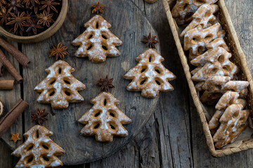 Christmas tree cookies on wooden background. New Year's food. Anise star. Festive baked goods....