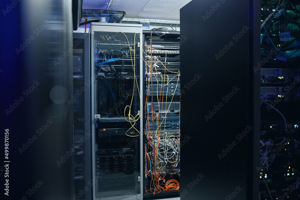 Poster A neat and tidy server room. Cropped shot of an empty and large server room.
