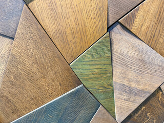 wooden texture, natural material polygons in different colors. green, blue and brown diamonds made...
