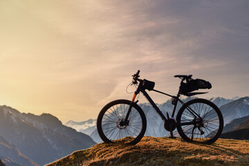 Fototapeta na wymiar Mountains Bicycle with bag for active riding recreation