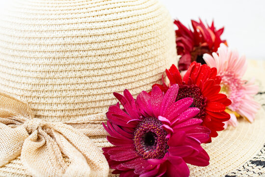 Woman's Sun Hat With Red Daisies And Jute Bow On White Background