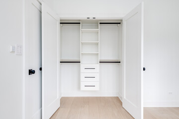 Custom Closet Organization. Contemporary closet design with shelves, drawers and rods.