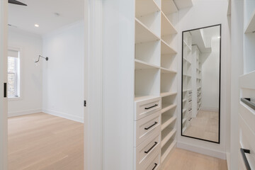 Custom Closet Organization. Contemporary closet design with shelves, drawers and rods.