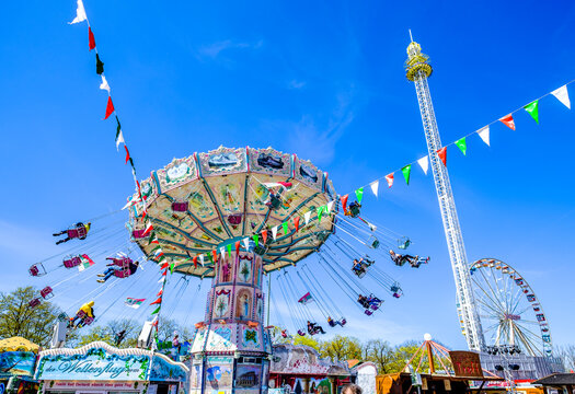 Augsburg, Germany - April 18: the largest Swabian folk festival, called the "Plärrer" with rides and visitors in Augsburg on April 18, 2022