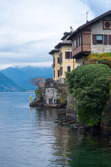 Fototapeta na wymiar Beautiful view of the lake Como in the Lombardy region of Italy on a cloudy day. Travel Italy.