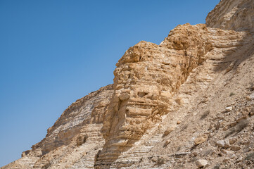 Fototapeta na wymiar Trail head of the Canyon of Ein Avdat National Park, oasis in the Negev Desert, Southern Israel, Text is: Ein Avdat, Ein Mor