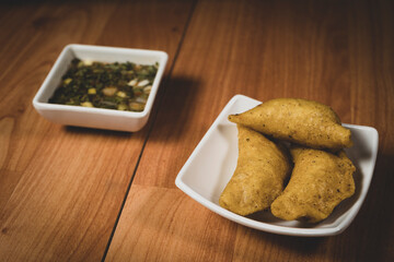 Delicious traditional Colombian empanadas with spicy sauce