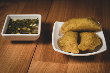 Delicious traditional Colombian empanadas with spicy sauce