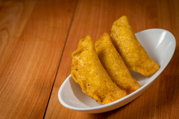 Colombian empanada with spicy sauce
